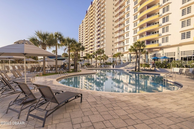 view of pool featuring a patio area