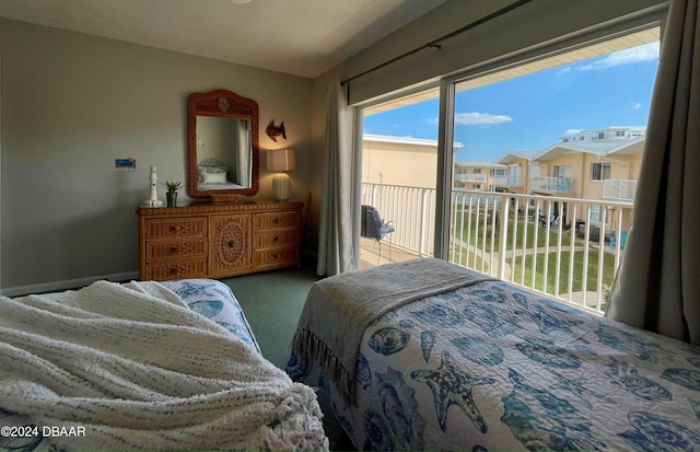 carpeted bedroom featuring access to exterior