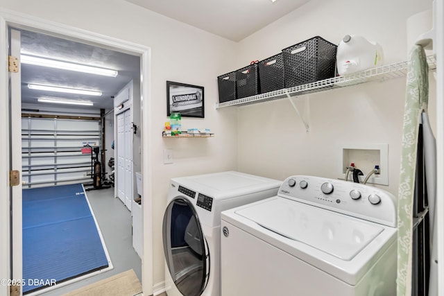 laundry area with washing machine and dryer and laundry area