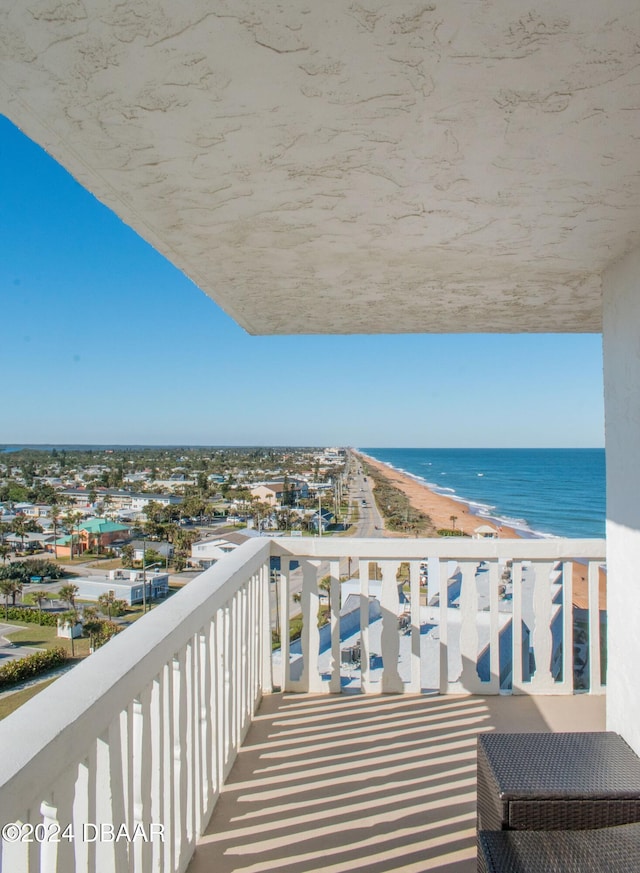 balcony with a view of the beach and a water view