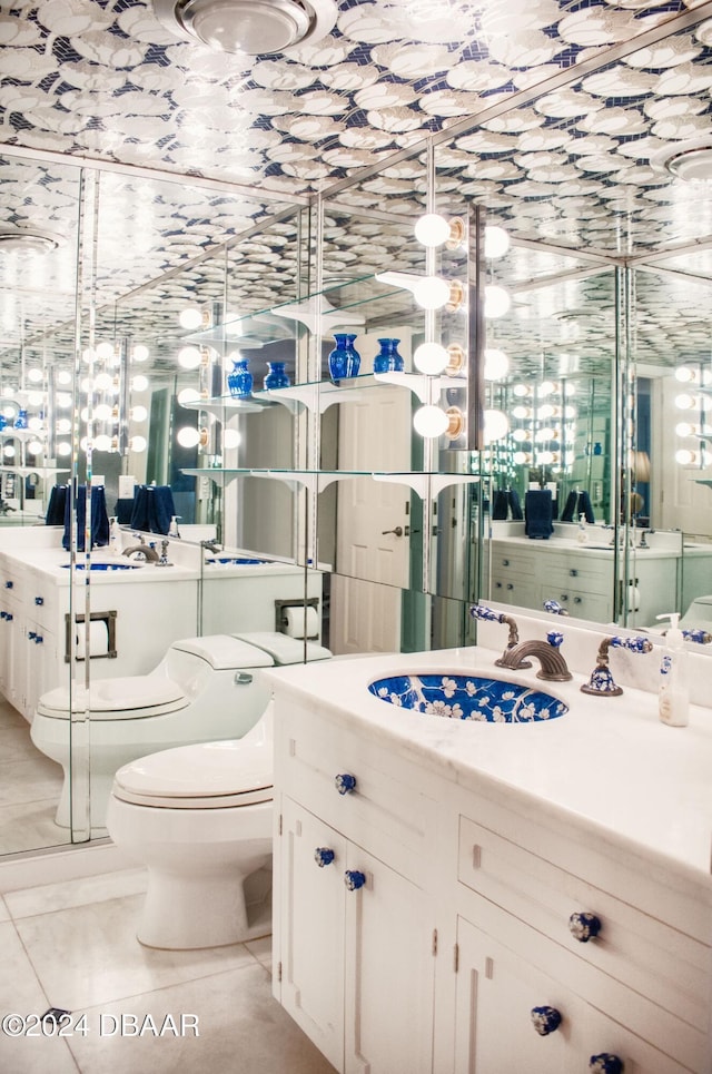 bathroom featuring tile patterned floors, vanity, and toilet