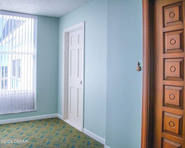 interior space with a textured ceiling