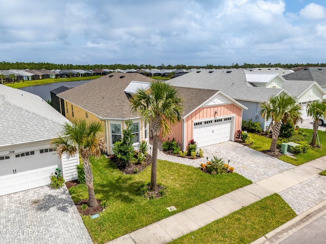 ranch-style home with a garage and a front yard