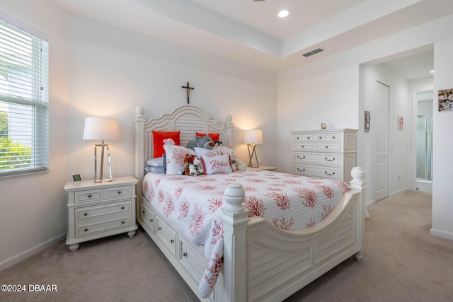 bedroom with light colored carpet