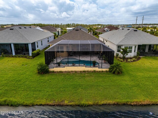 318 Good Life Way, Daytona Beach, FL 32124 - outdoor pool featuring a patio area, a lawn, a residential view, and a lanai