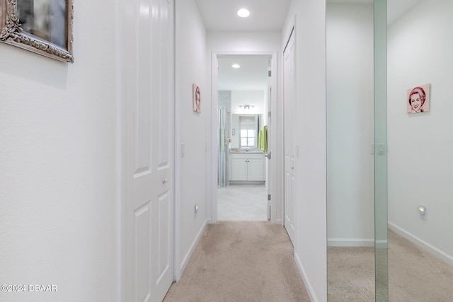 corridor with light colored carpet