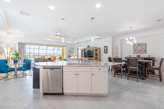 kitchen with white cabinetry, sink, stainless steel dishwasher, a kitchen island with sink, and pendant lighting