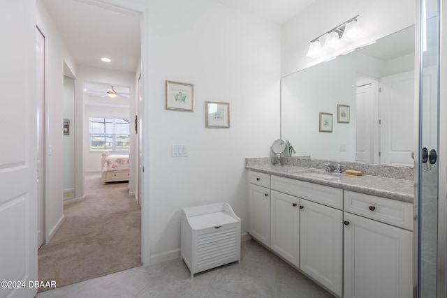 bathroom featuring vanity, tile patterned flooring, and ceiling fan