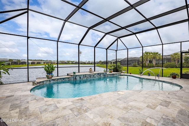 view of pool featuring a lanai, a water view, pool water feature, and a patio area