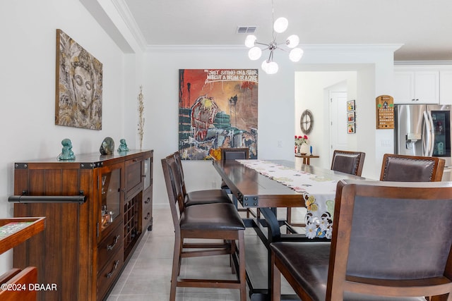 dining room featuring a chandelier, light tile patterned floors, and crown molding