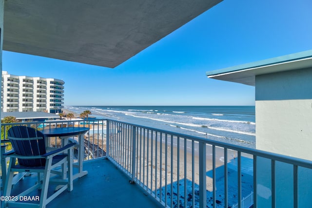 balcony with a view of the beach and a water view