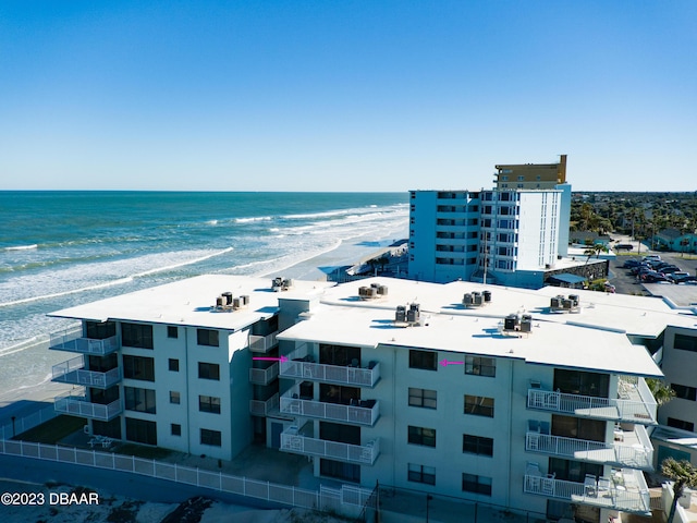 aerial view featuring a view of the beach and a water view