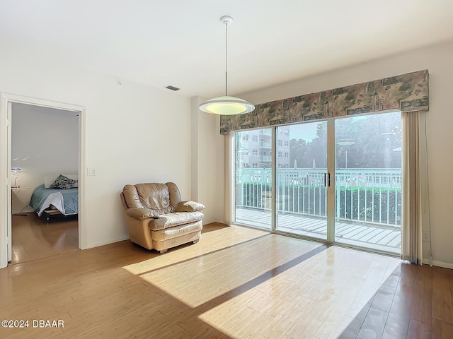 unfurnished room with hardwood / wood-style floors