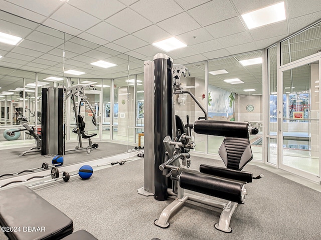 workout area with a drop ceiling