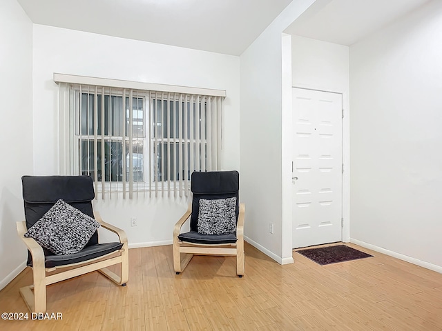 living area featuring hardwood / wood-style floors