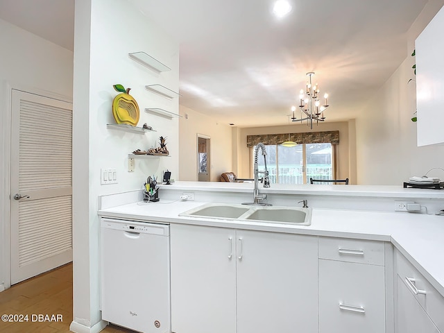 kitchen featuring dishwasher, white cabinets, a chandelier, sink, and light hardwood / wood-style flooring