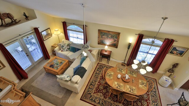 living room with an inviting chandelier and french doors