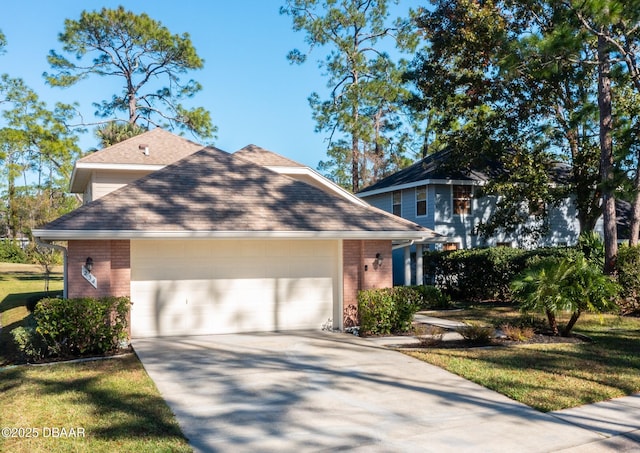 view of front of house with a garage and a front yard