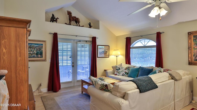 living room with ceiling fan and lofted ceiling