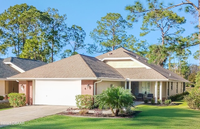 view of front of property featuring a front lawn and a garage