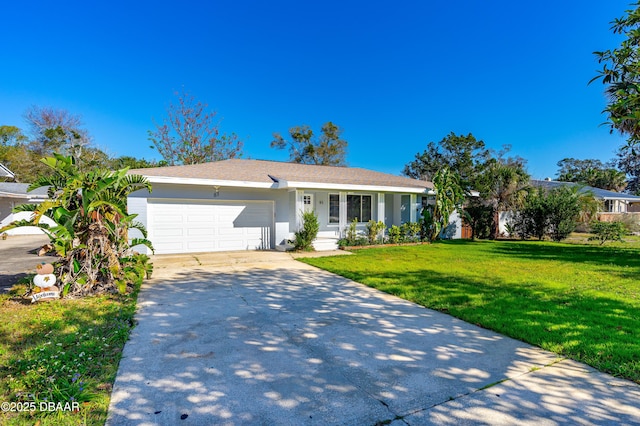 single story home featuring concrete driveway, an attached garage, and a front yard