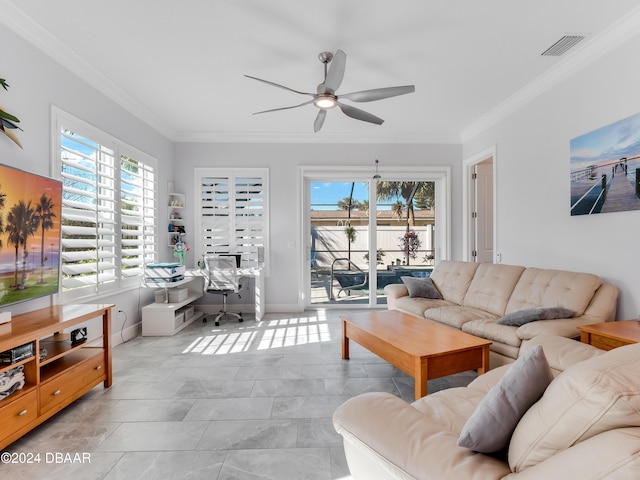 living room featuring ceiling fan, ornamental molding, and a wealth of natural light