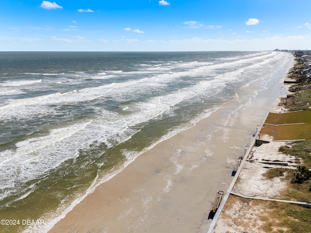 bird's eye view featuring a water view and a view of the beach