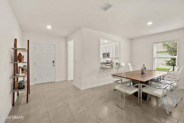 dining room featuring light tile patterned floors