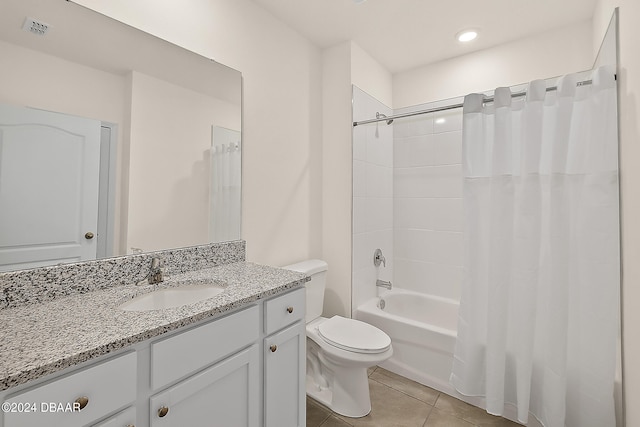 full bathroom featuring toilet, shower / tub combo, vanity, and tile patterned floors