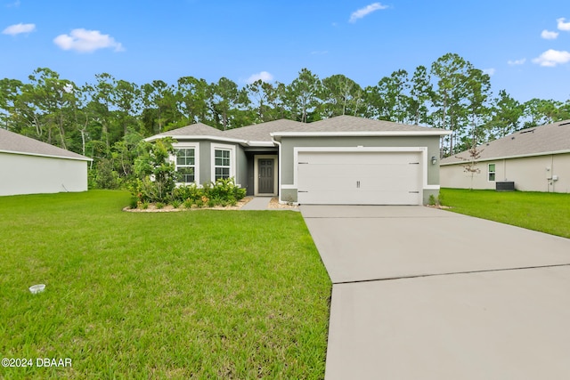 view of front facade with a garage and a front lawn