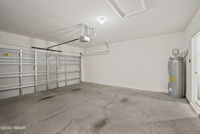 garage featuring water heater and a garage door opener