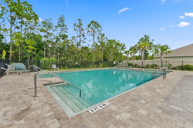 view of swimming pool featuring a patio