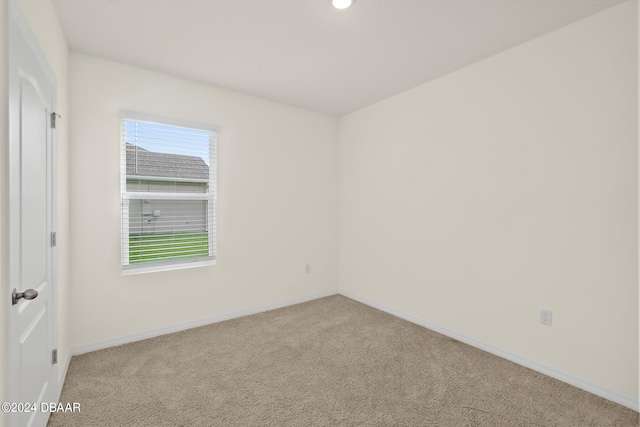 empty room with light colored carpet