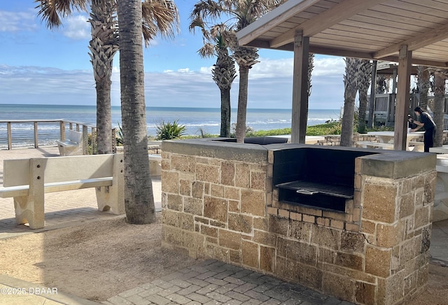 view of patio with a water view