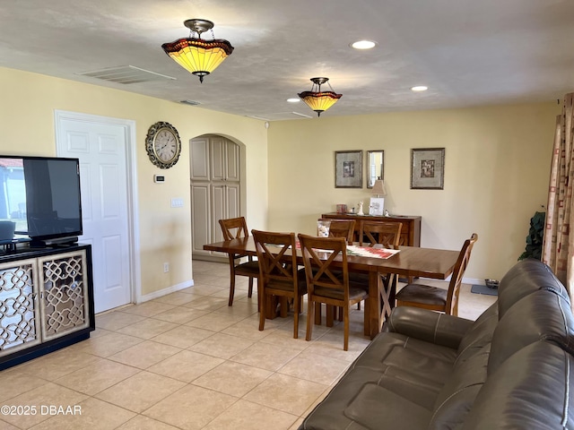 dining area with light tile patterned floors