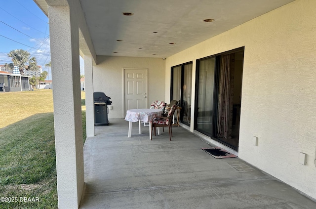 view of patio featuring a grill