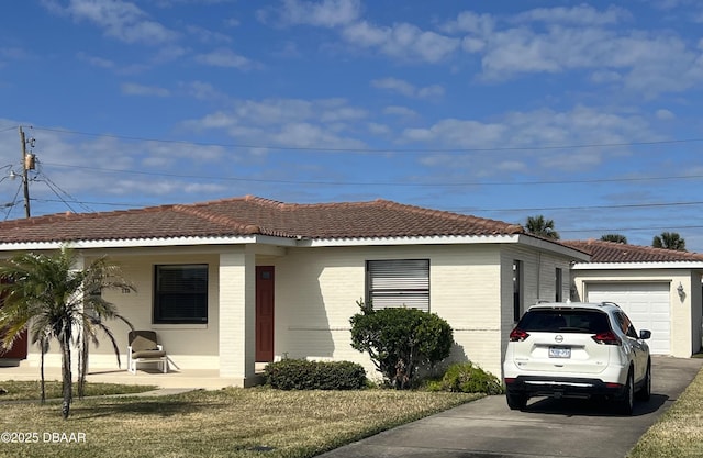 exterior space featuring a garage and a lawn