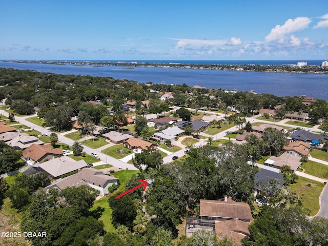 birds eye view of property with a residential view and a water view