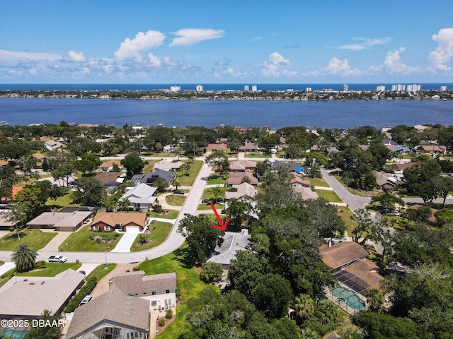 bird's eye view featuring a water view and a residential view