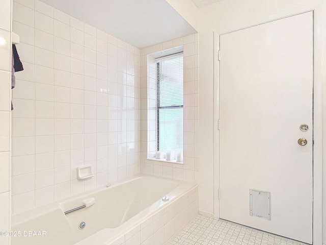 full bathroom with plenty of natural light, tiled tub, and tile patterned flooring