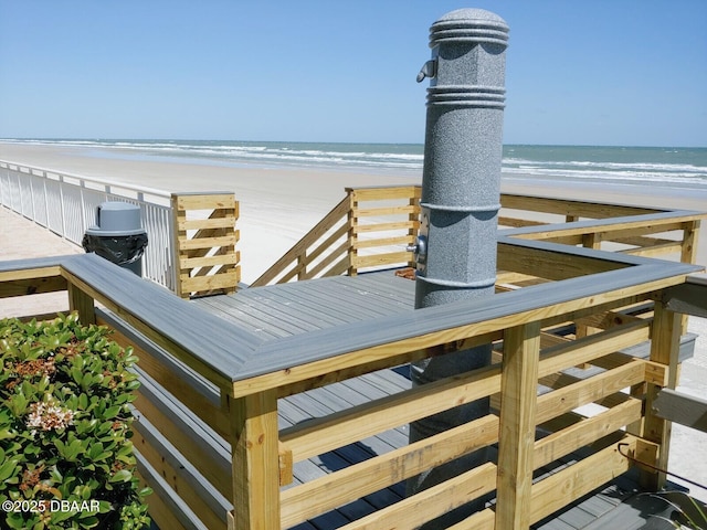 exterior space with a beach view and a water view