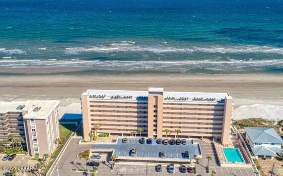 aerial view with a view of the beach and a water view