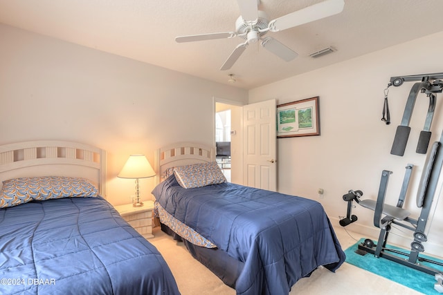 carpeted bedroom featuring ceiling fan