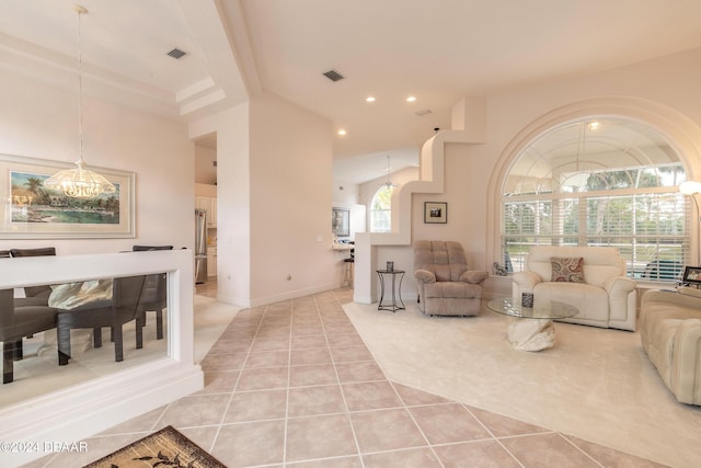 tiled living room with vaulted ceiling with beams