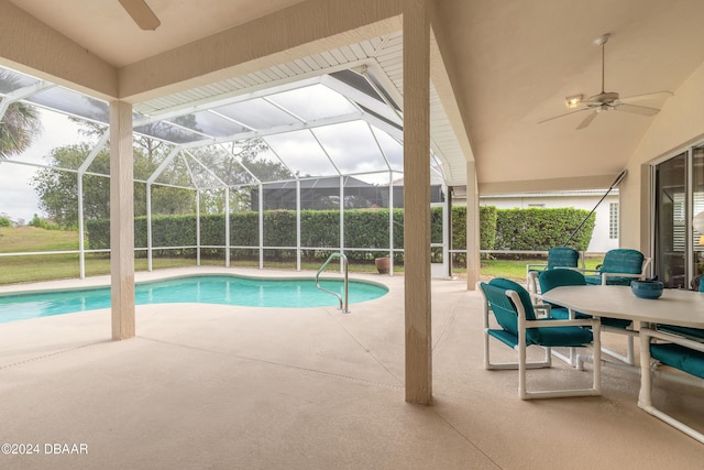 view of swimming pool with a lanai, a patio area, and ceiling fan