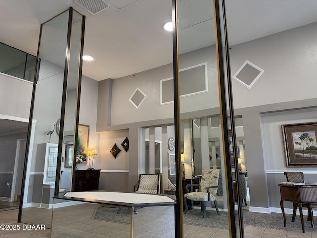 2615 S Atlantic Ave Unit 1D, Daytona Beach, FL 32118 - community lobby featuring a high ceiling and recessed lighting