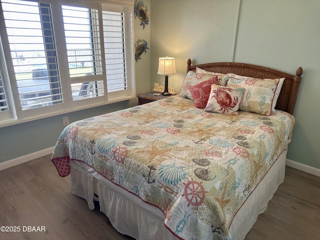 2615 S Atlantic Ave Unit 1D, Daytona Beach, FL 32118 - bedroom with baseboards and wood finished floors