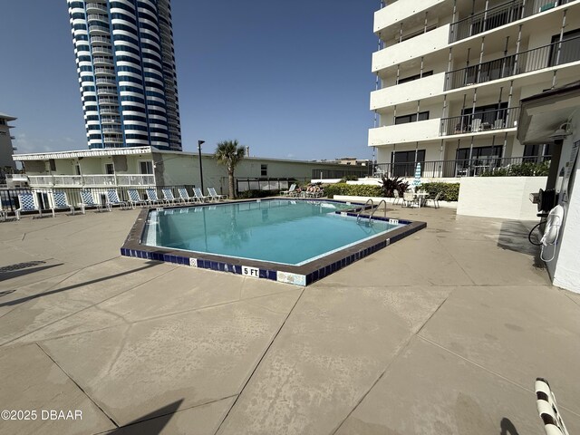 2615 S Atlantic Ave Unit 1D, Daytona Beach, FL 32118 - community pool with a patio area