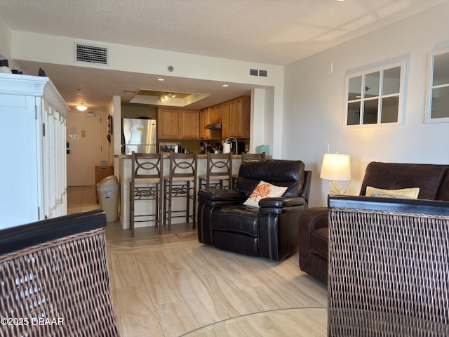 2615 S Atlantic Ave Unit 1D, Daytona Beach, FL 32118 - living area with a textured ceiling