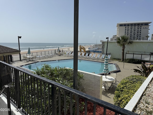 2615 S Atlantic Ave Unit 1D, Daytona Beach, FL 32118 - community pool featuring a water view and a patio area